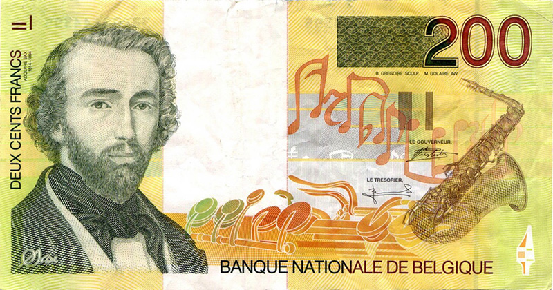 Старая бельгийская банкнота с изображением Адольфа Сакса и его знаменитого изобретения